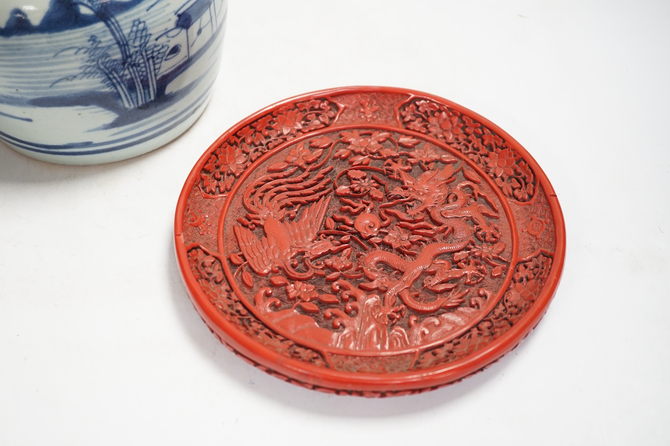 A Chinese blue and white jar and red cinnabar style lacquer tray, jar 16.5cm high. Condition - fair